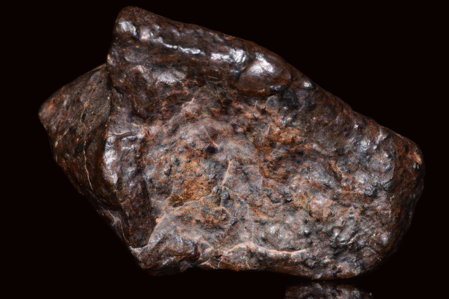 Natural fragment of NWA 13272 ungrouped achondrite meteorite, 10.5g, showcasing its rocky, textured surface and mineral details.
