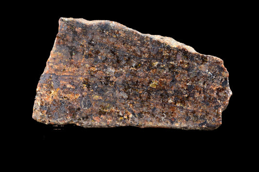 Close-up of NWA 14234 H7 meteorite fragment weighing 0.71 grams, showcasing its dark, textured surface with natural mineral features.