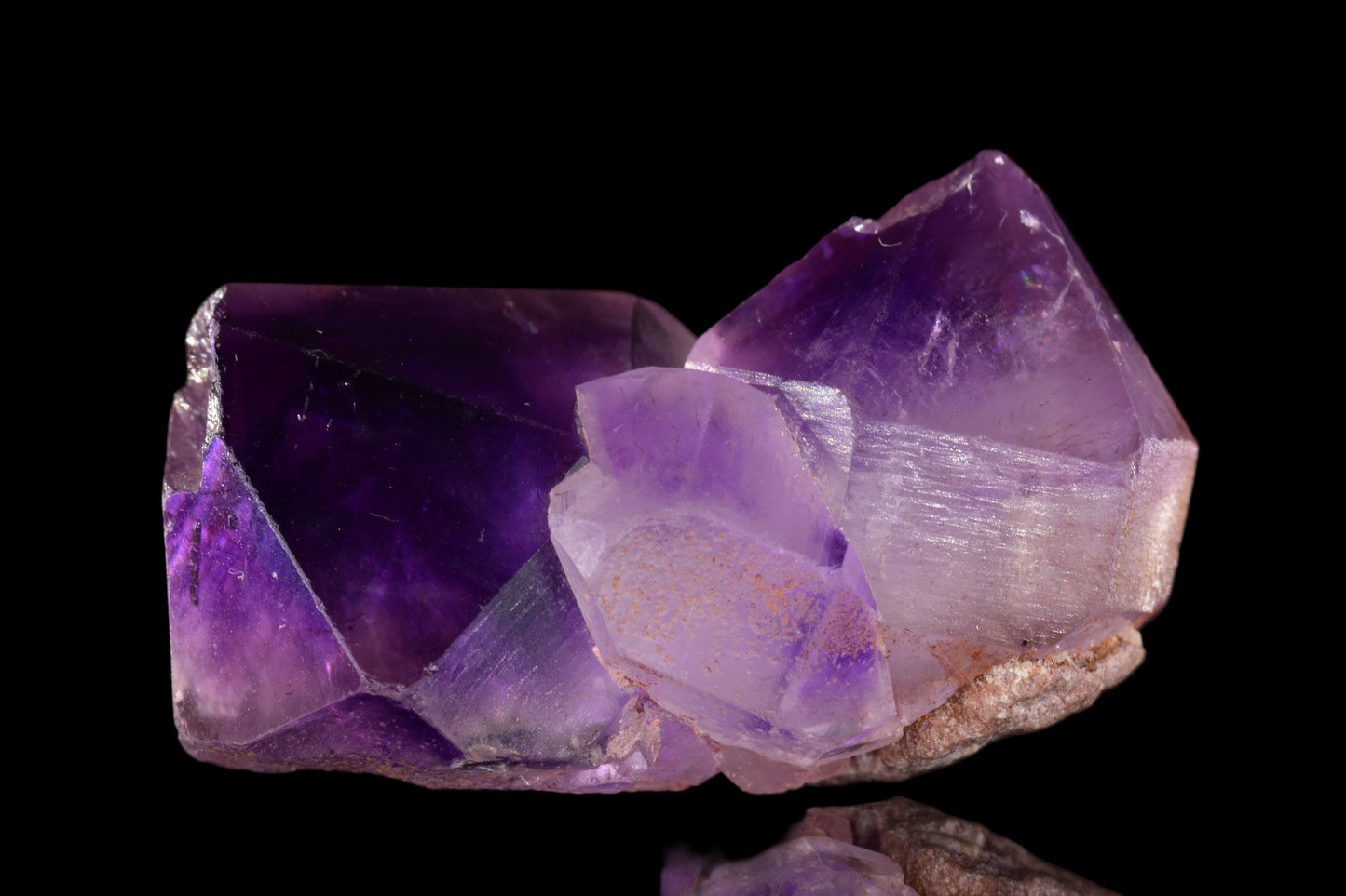 A vibrant purple amethyst crystal from Morocco with natural crystal formations, showcased by Buy Meteorite LLC.