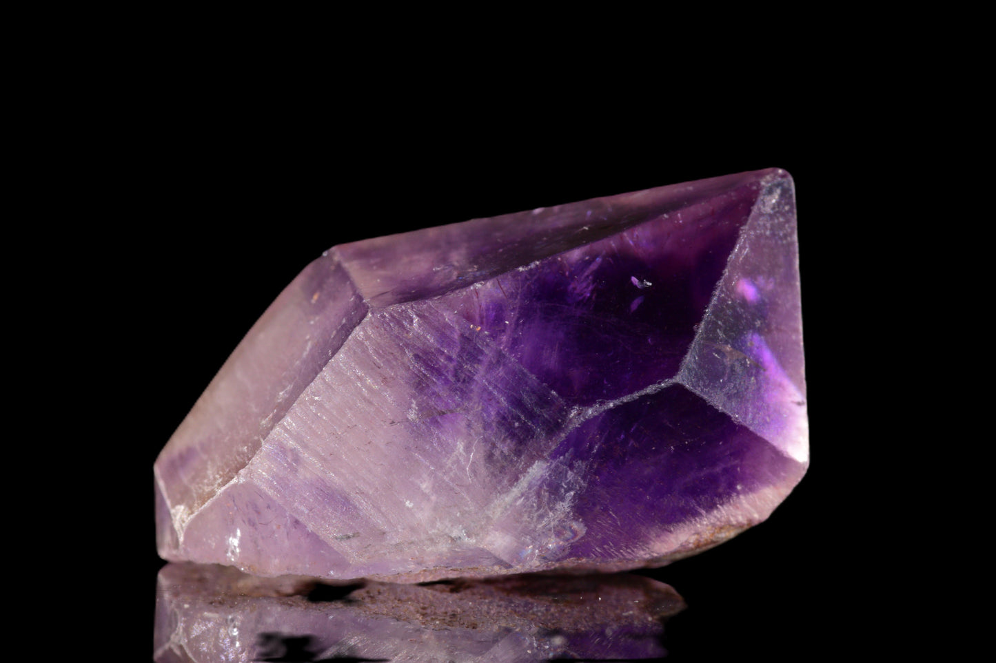 Amethyst Morocco crystal from Buy Meteorite LLC, showing purple amethyst gemstone with natural crystal formations against a neutral background.