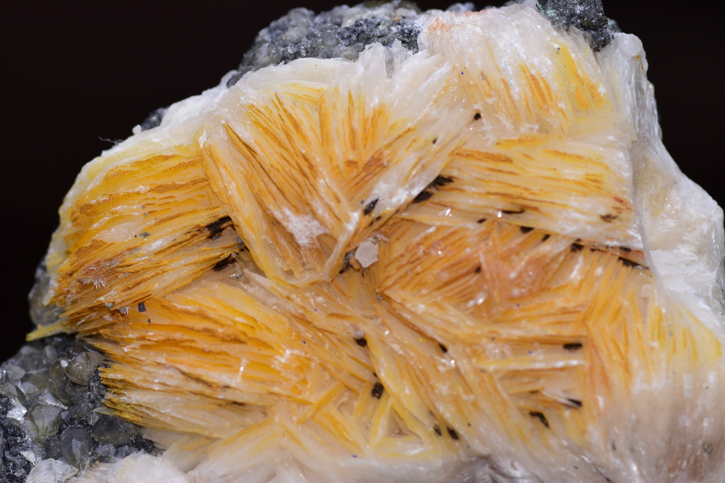 Crystalline cerussite on barite from Mibladen district in Morocco, showcasing mineral formation and natural mineral colors.
