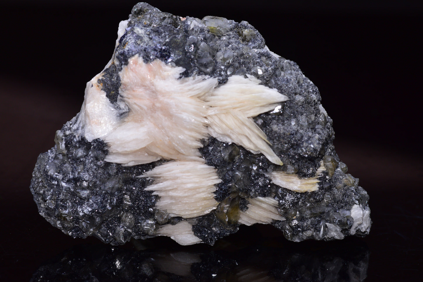 Cerussite crystals on barite mineral specimen from Mibladen district Morocco, showcasing clear white and blue mineral formations.