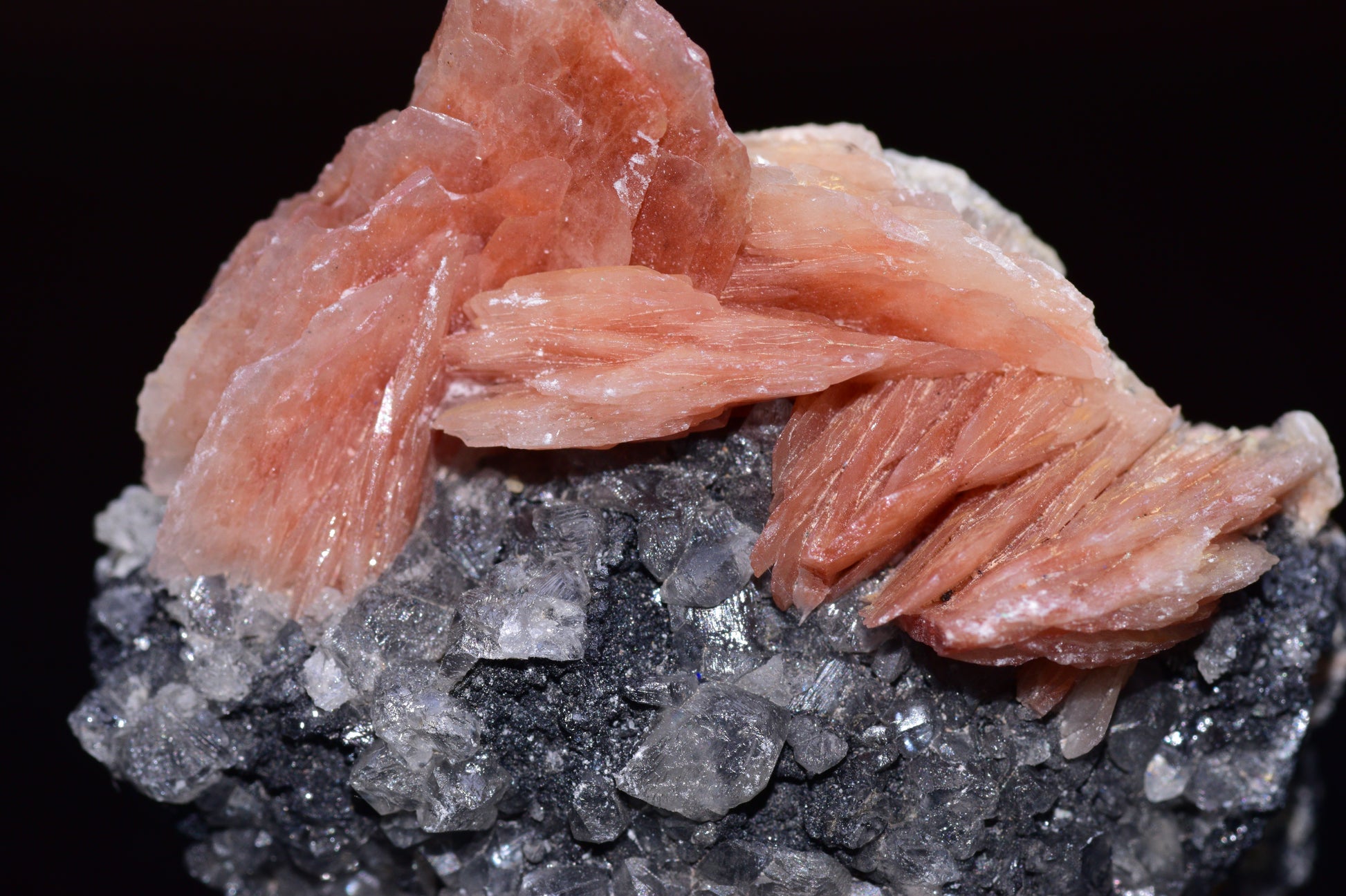 Crystalline cerussite on barite mineral specimen from Mibladen district, Morocco, featuring transparent and white mineral formations.