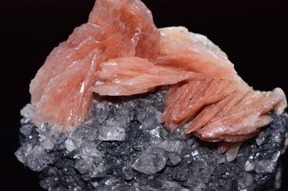 Crystalline cerussite on barite mineral specimen from Mibladen district, Morocco, featuring transparent and white mineral formations.