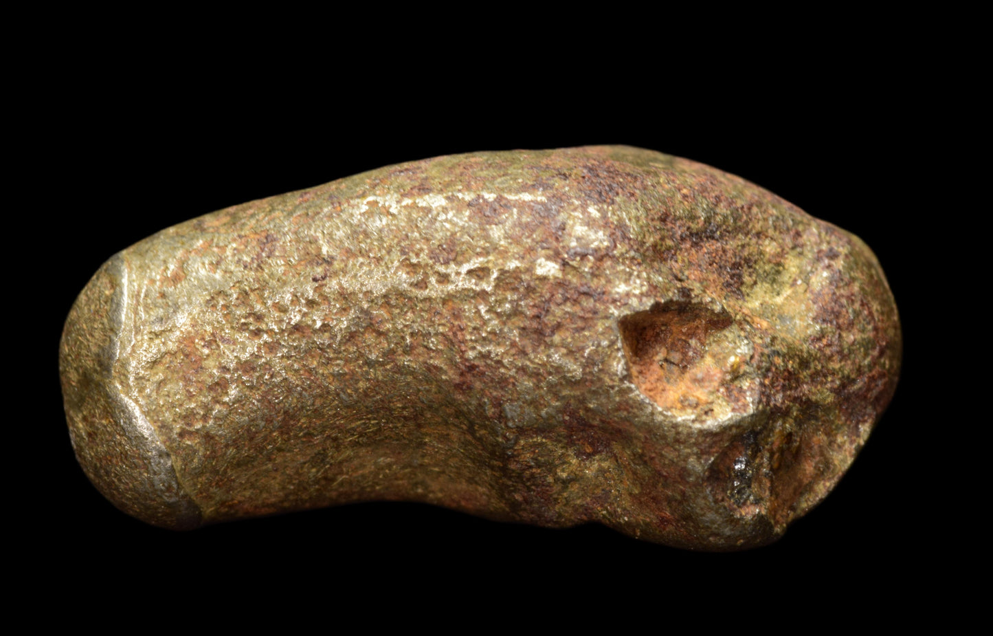 Golden Pallasite meteorite weighing 4.41 grams, featuring golden crystals and metallic surface, displayed on a plain background.