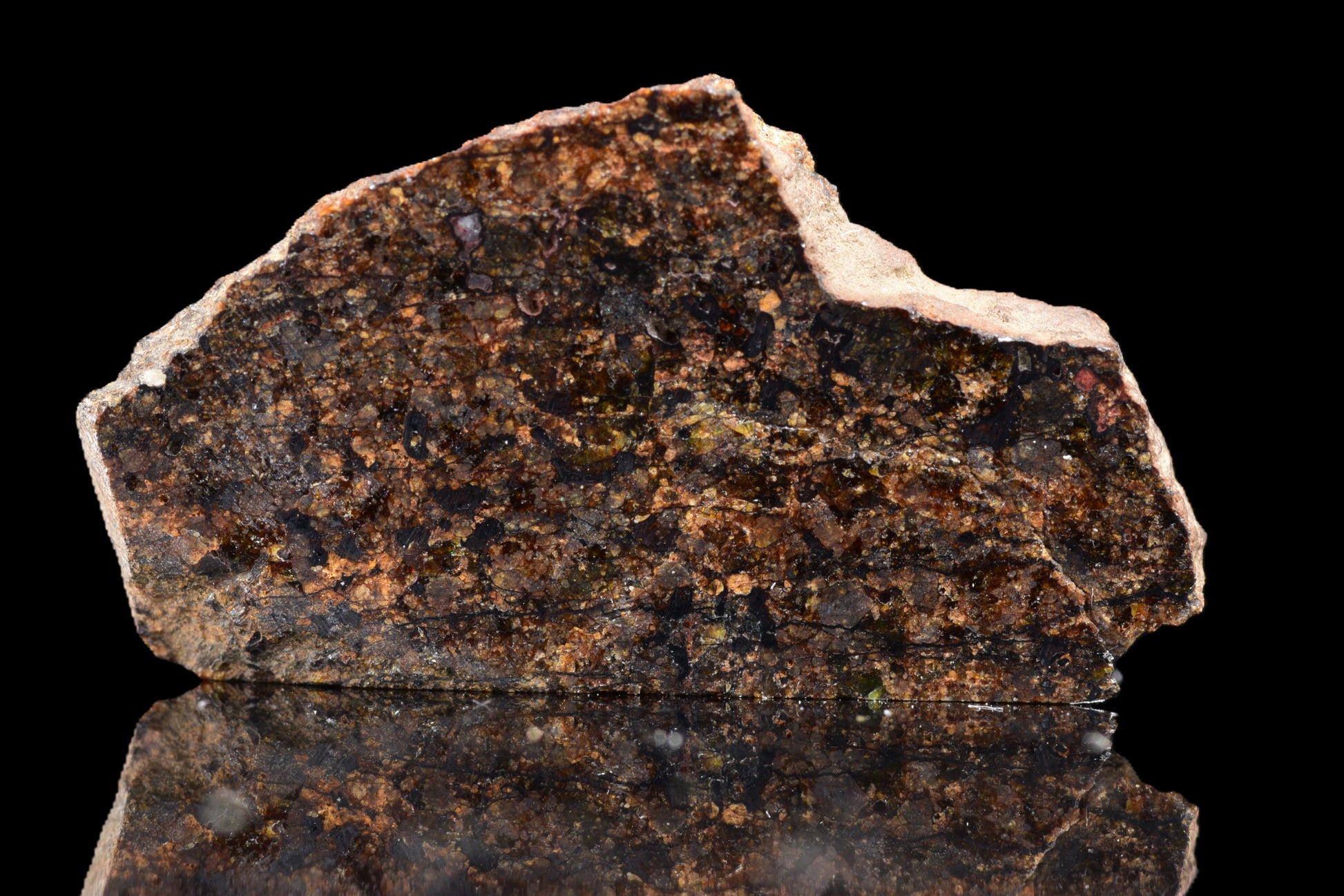 Close-up of NWA 14234 H7 meteorite, a rare 1.29 g space rock with a rugged, metallic surface and matrix details.