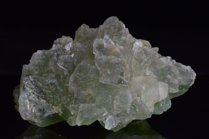 Green fluorite crystal from El Hammam Morocco, showcasing vibrant green hues and natural mineral formations.