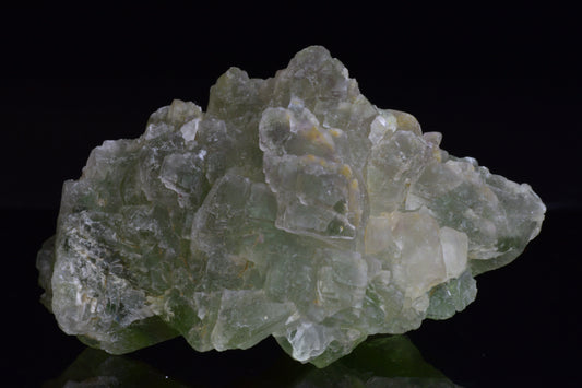 Green fluorite crystal from El Hammam Morocco, showcasing vibrant green hues and natural mineral formations.