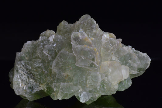 Green fluorite crystal from El Hammam, Morocco, showcasing vibrant green hues and natural mineral formations.