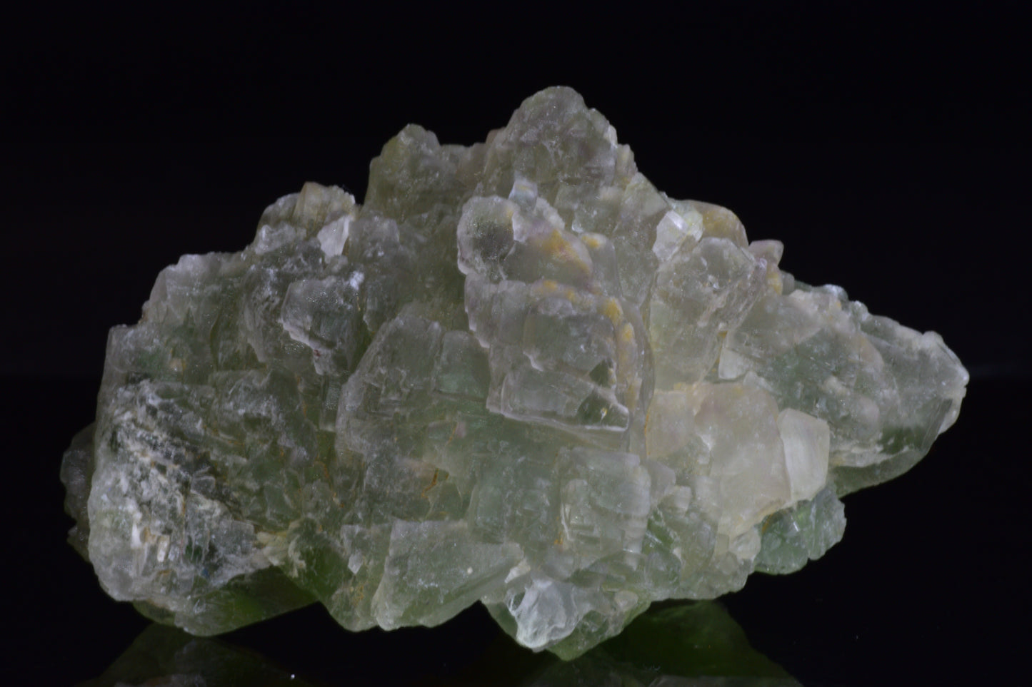 Green fluorite crystal from El Hammam Morocco, showcasing vibrant green hues and natural mineral formations.