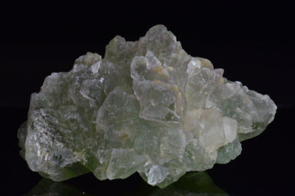 Green fluorite crystal from El Hammam Morocco, showcasing vibrant green hues and natural mineral formations.