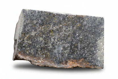 NWA 11757 Ureilite meteorite fragment weighing 7.6 grams, showcasing its dark, rocky surface and mineral-rich interior.