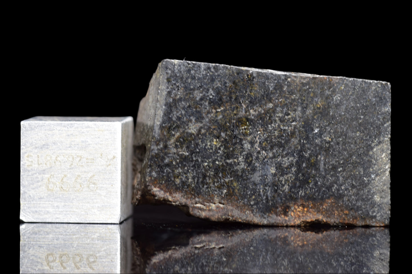 Close-up of NWA 11757 Ureilite meteorite from Buy Meteorite, LLC, showing its dark, rocky surface and unique mineral textures.