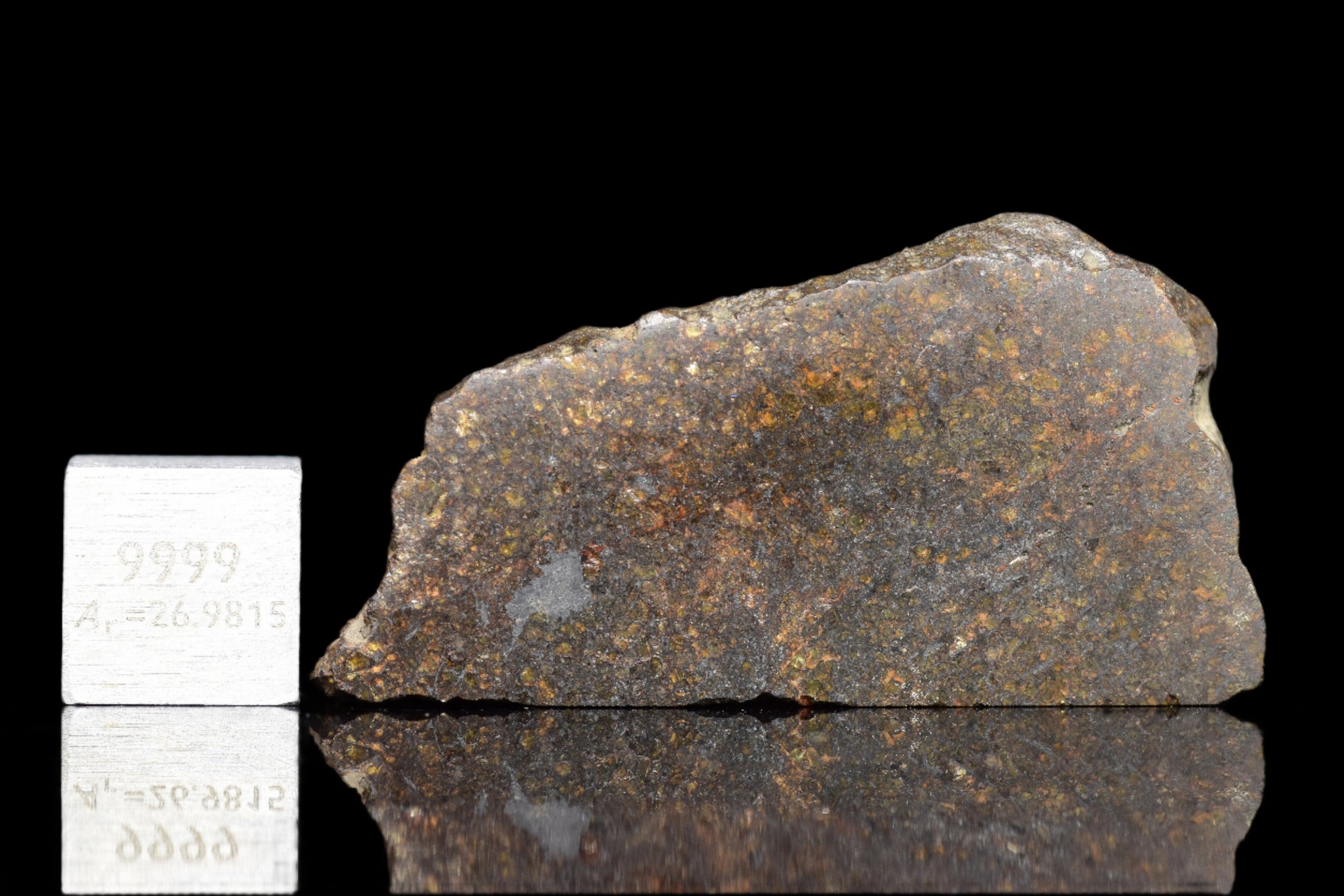 NWA 11757 Ureilite meteorite specimen from Buy Meteorite, LLC, showing dark, textured surface with mineral inclusions and unique formation.