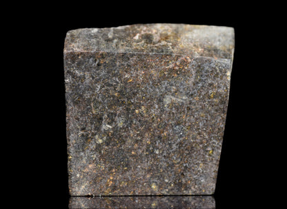 NWA 11757 Ureilite meteorite fragment with dark, metallic surface and mineral textures, weighing 9.9 grams.