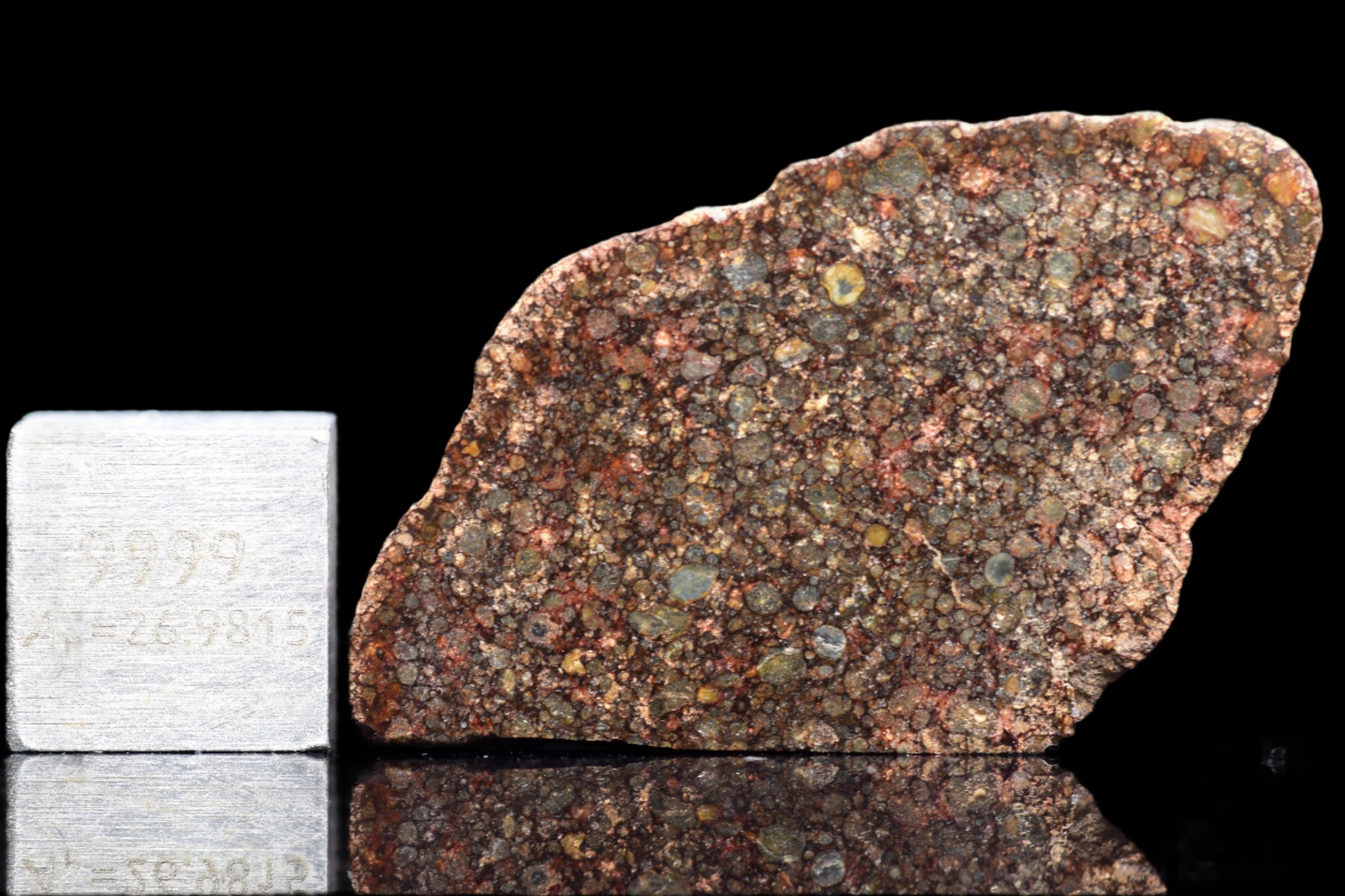 NWA 12341 L3 meteorite, 3.7 grams, showing its dark fusion crust and interior structure, from Buy Meteorite, LLC.