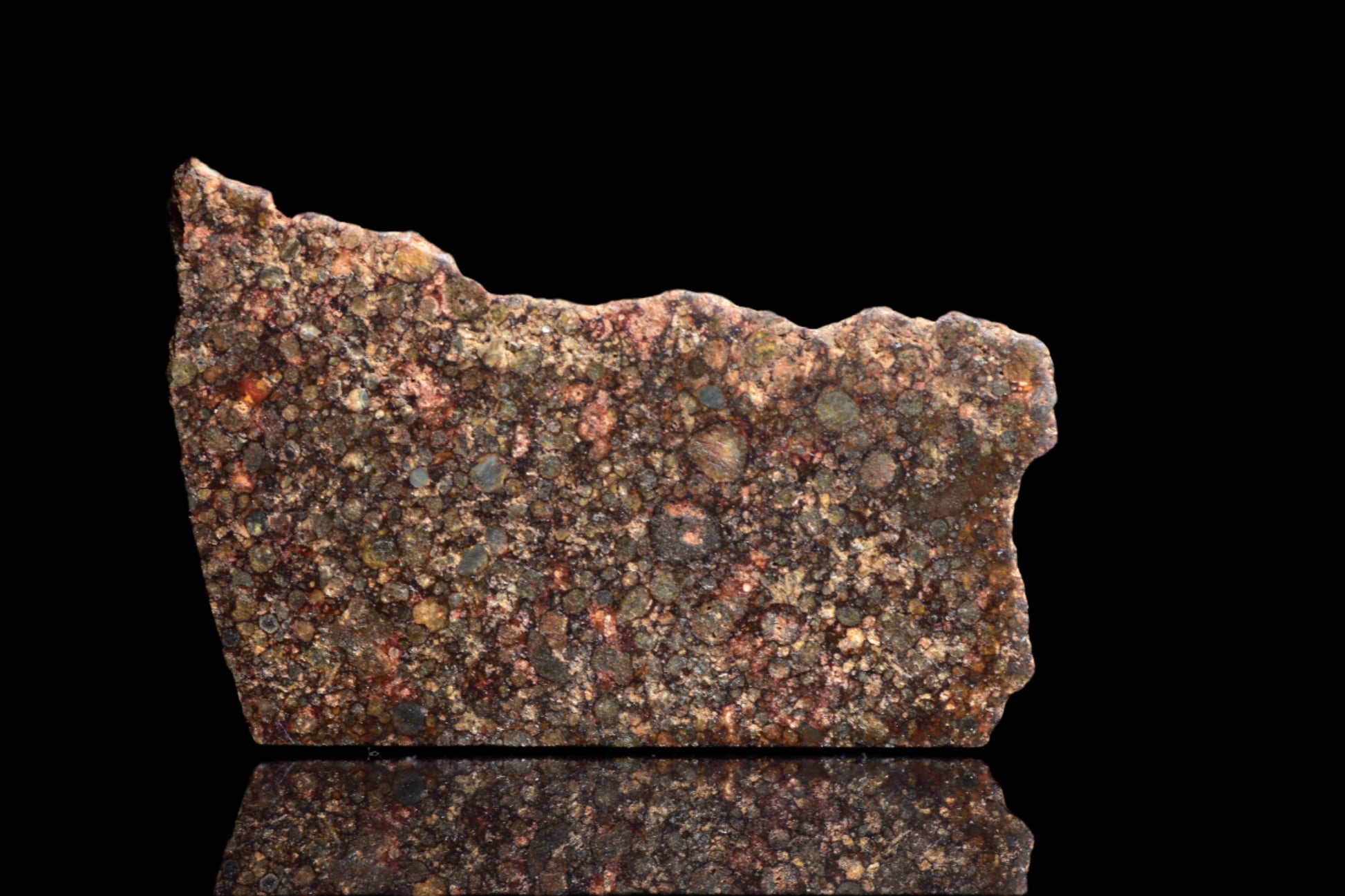 NWA 12341 L3 meteorite, 2.6 grams, showing chondrite texture and dark exterior, from Buy Meteorite, LLC.