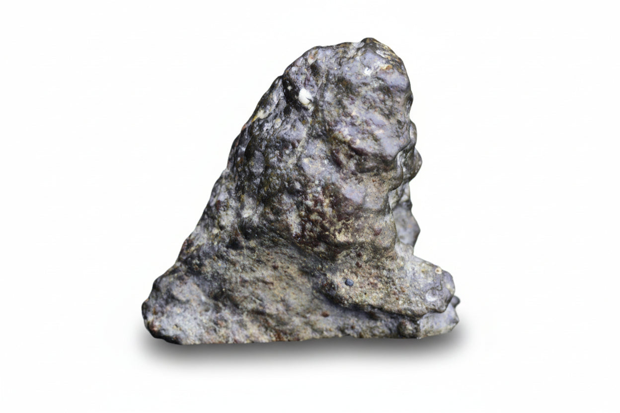 Close-up of NWA 12344 Eucrite meteorite endcut showing its textured, dark surface and mineral details.