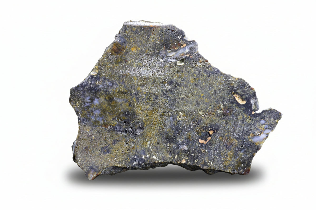 NWA 12344 Eucrite meteorite slice showing dark crust and mineral texture, 2.6 grams, from Buy Meteorite LLC.