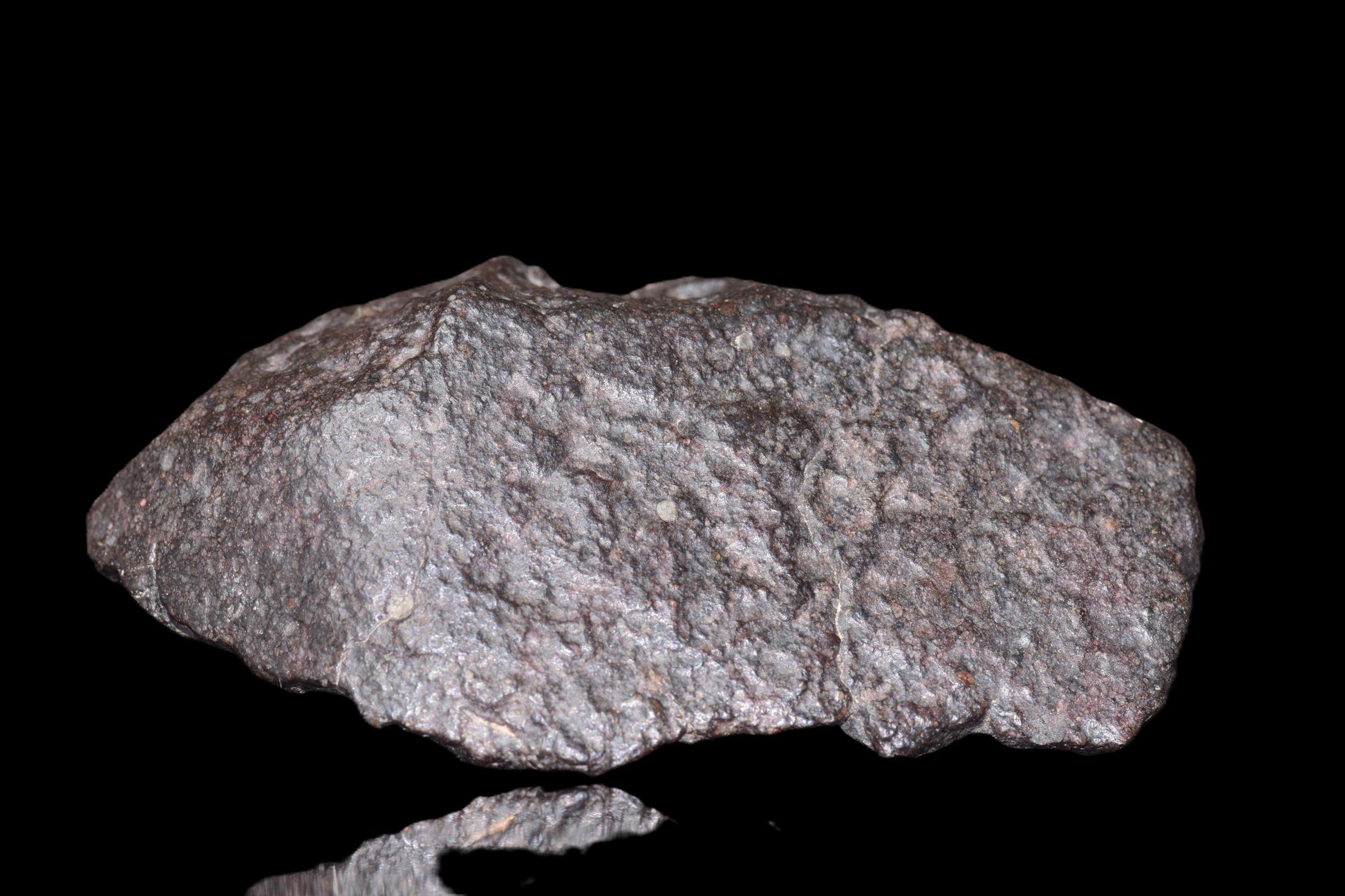 NWA 14003 H4 ordinary chondrite meteorite weighing 108.2 grams, shown with its textured, dark surface and mineral details.