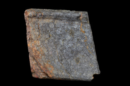 NWA 14224 LL3 meteorite slice weighing 1.52 grams, showcasing dark fusion crust and metal-rich interior, from Buy Meteorite, LLC.
