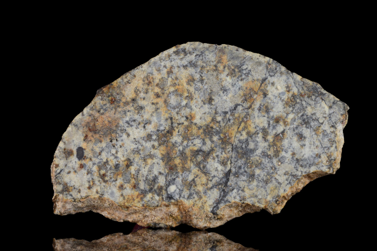 NWA 14225 LL6 chondrite meteorite with a rugged, irregular surface and a dark, rocky appearance, weighing 2.34 grams.