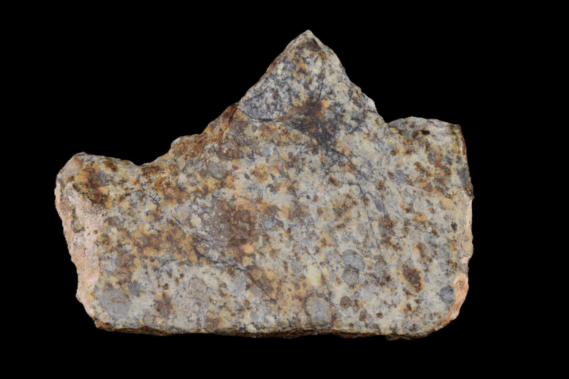 NWA 14225 LL6 meteorite chondrite specimen weighing 7.10 grams, with a textured, dark exterior and mineral inclusions.