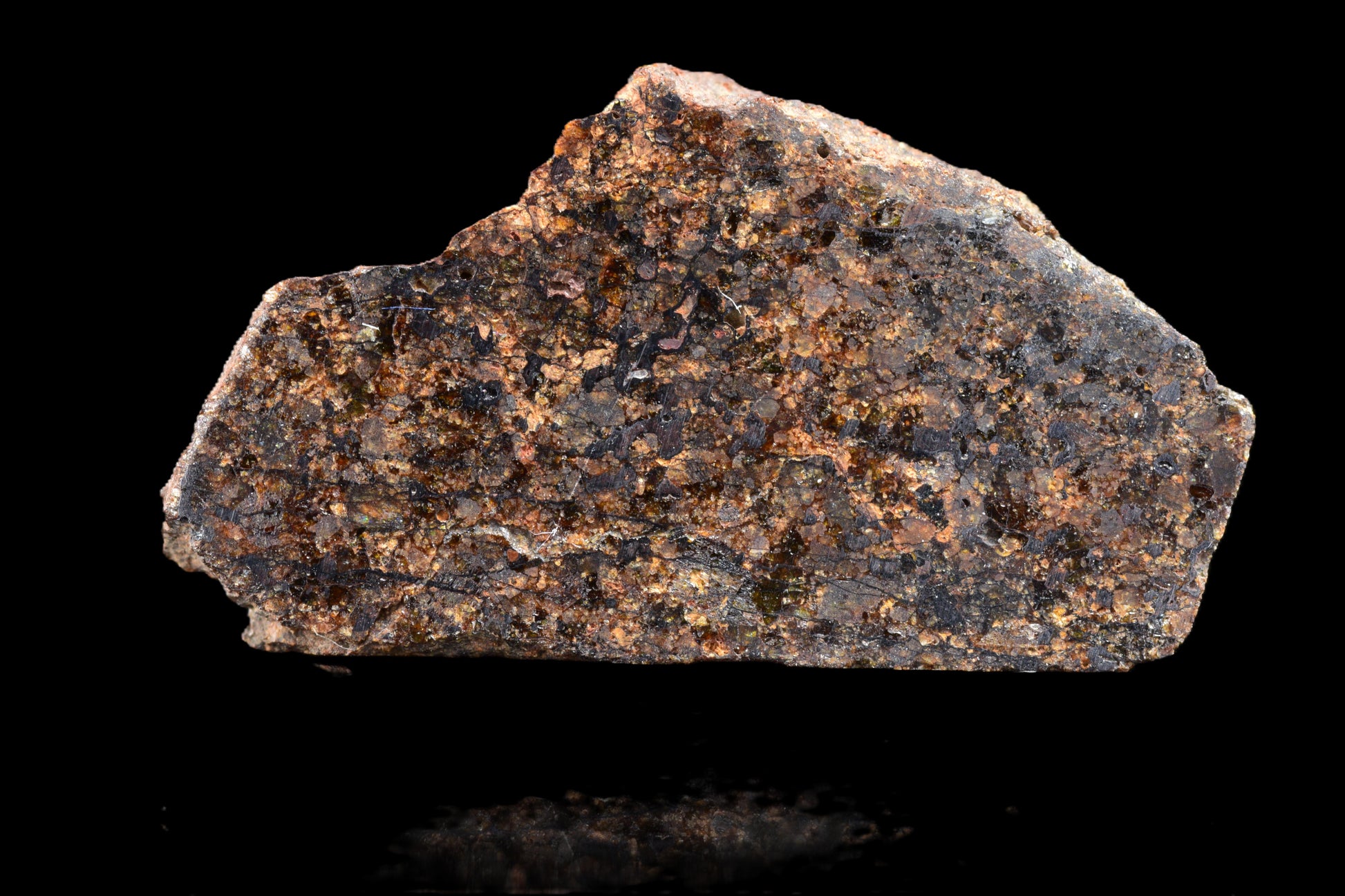 NWA 14234 H7 meteorite specimen weighing 1.29 grams, showcasing dark fusion crust and metallic mineral interior.