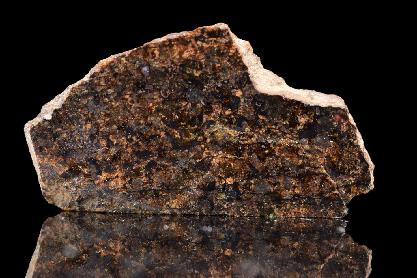 NWA 14234 H7 meteorite specimen weighing 1.29 grams, showcasing its dark, textured surface with unique mineral features.