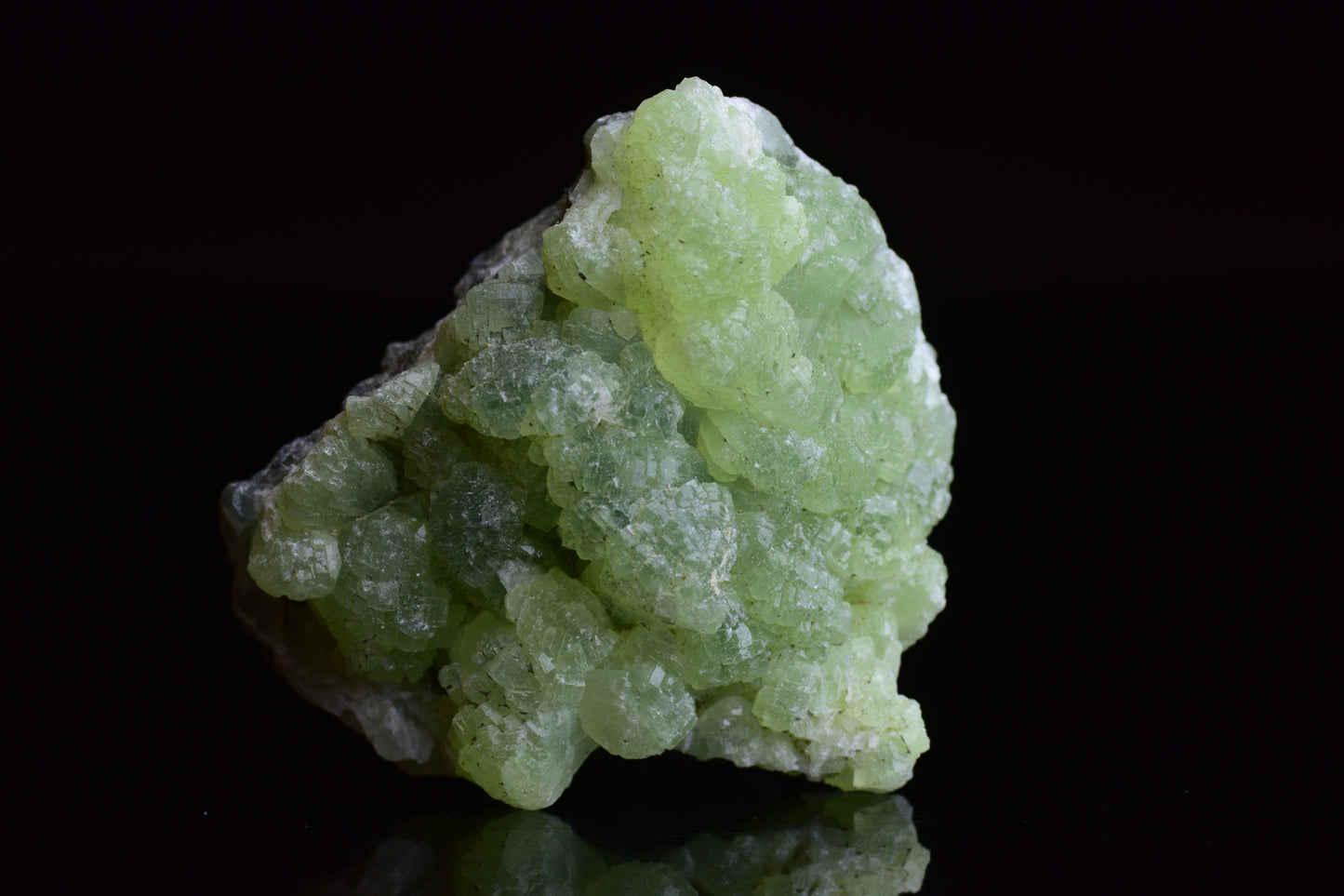 Prehnite and actinolite crystal duo from Boulemane, Morocco, showcasing vibrant green mineral specimens.