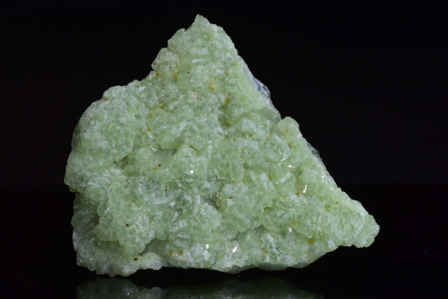 Raw prehnite and actinolite crystal specimen from Boulemane, Morocco, showcasing green mineral formations.