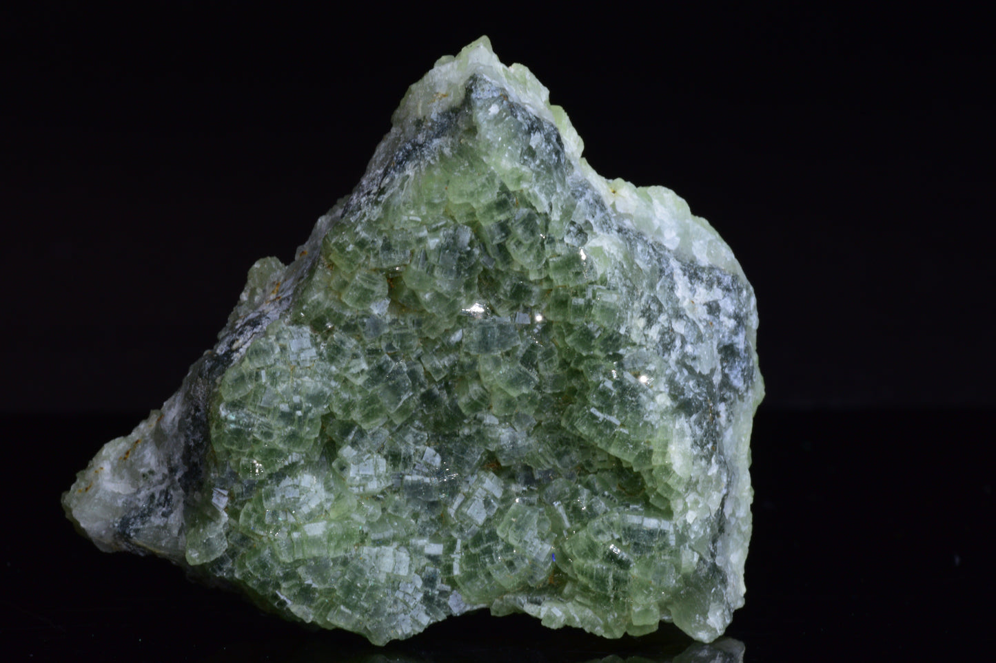 Prehnite and actinolite crystal from Boulemane, Morocco, showcasing vibrant green mineral formations and natural crystal structure.