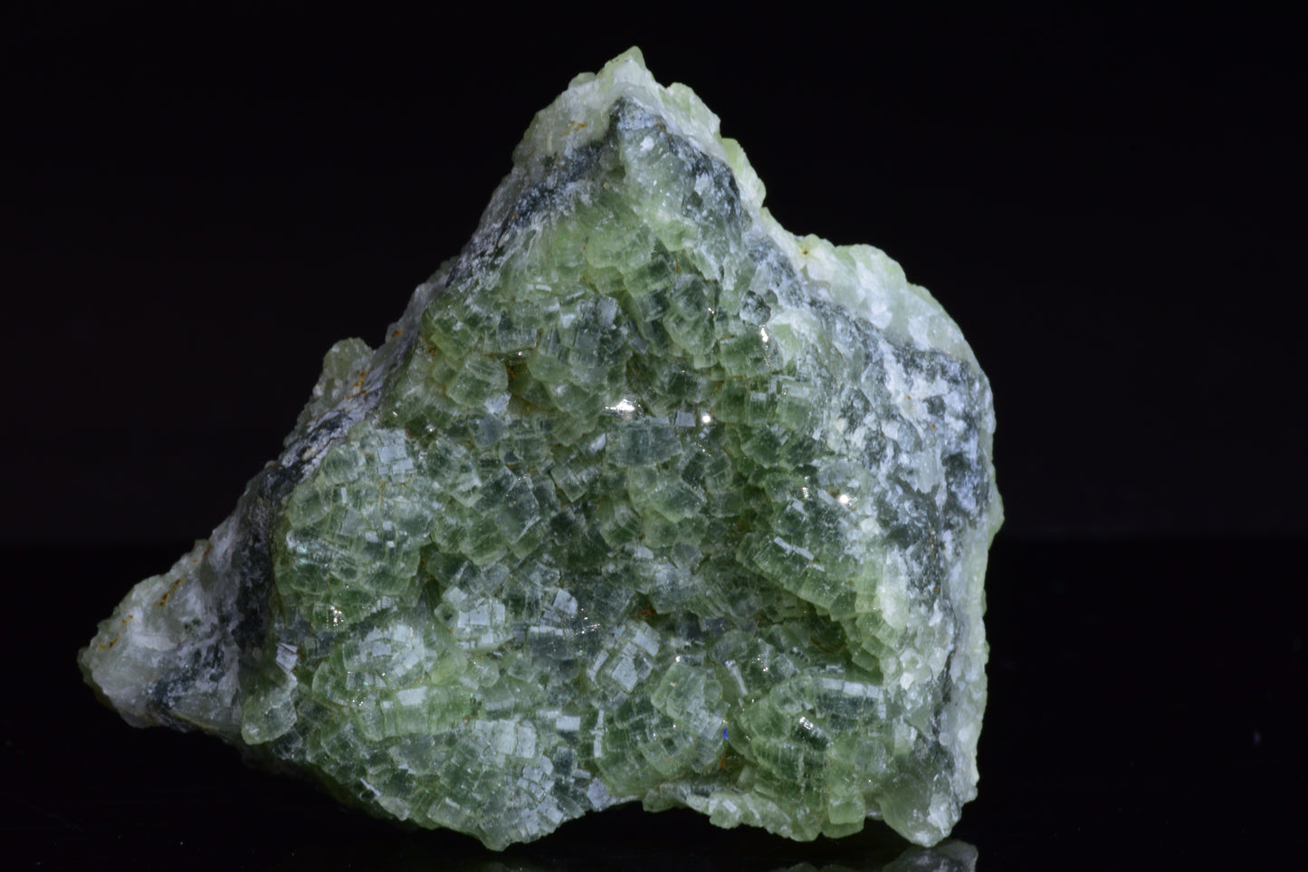 Prehnite and actinolite crystal from Boulemane, Morocco, showcasing green and gray mineral formations.