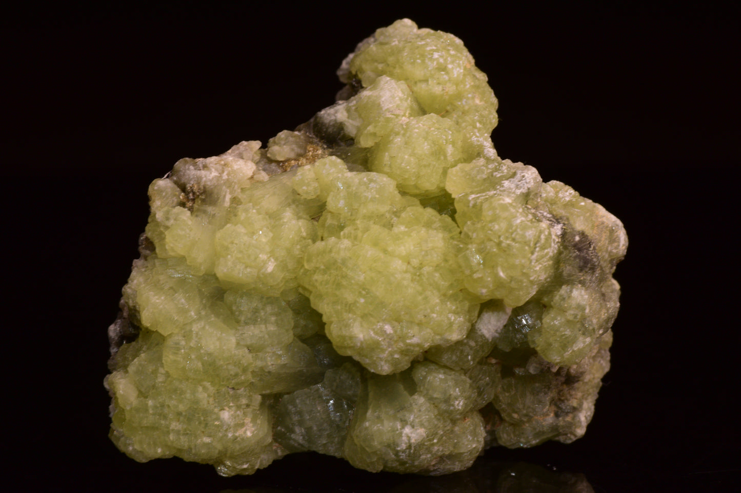 Prehnite and actinolite crystal from Boulemane, Morocco, showcasing green mineral formations and natural stone textures.