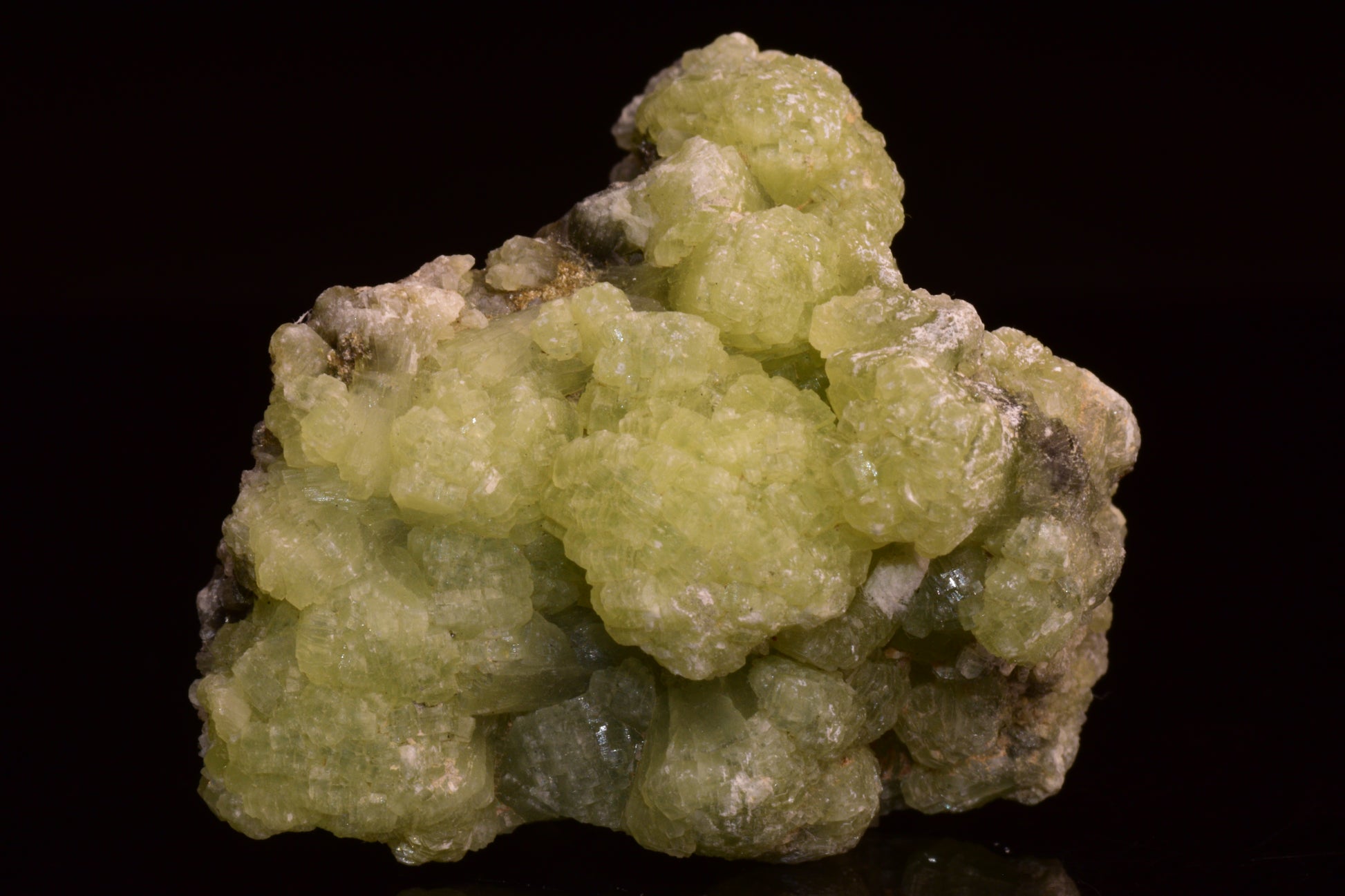 Prehnite and actinolite crystal from Boulemane, Morocco, showcasing green mineral formations with vibrant textures.