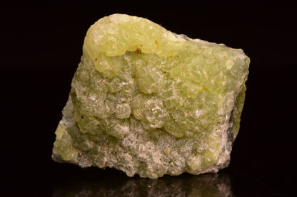 Prehnite and actinolite crystal from Boulemane, Morocco, showcasing vibrant green mineral formations in a natural stone specimen.