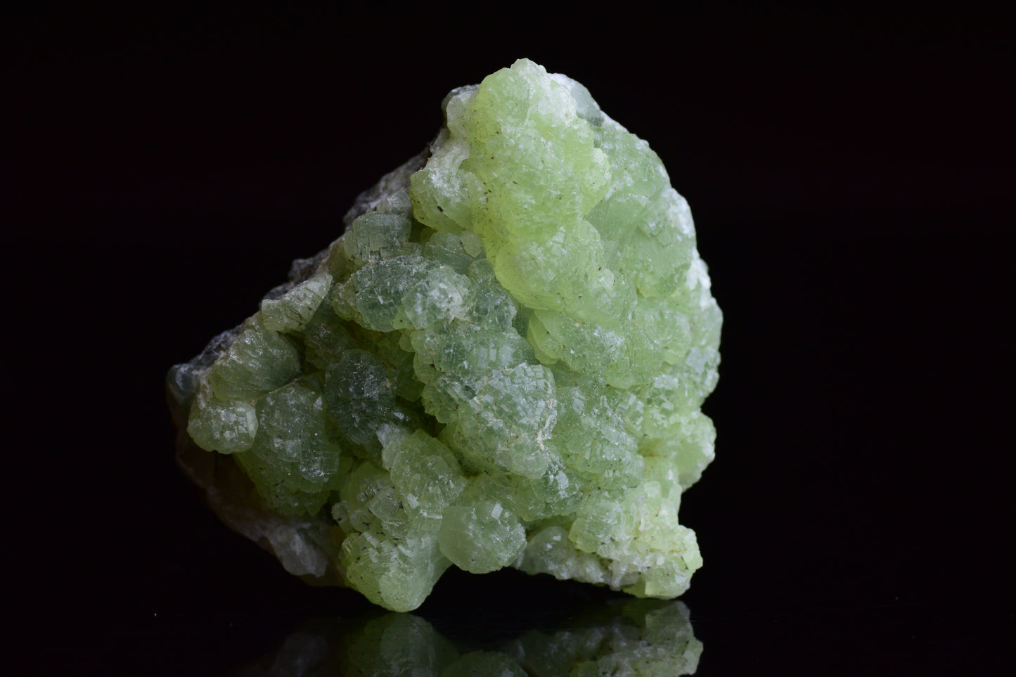 Raw Prehnite and Actinolite crystal specimen from Boulemane, Morocco, showcasing vibrant green mineral formations.