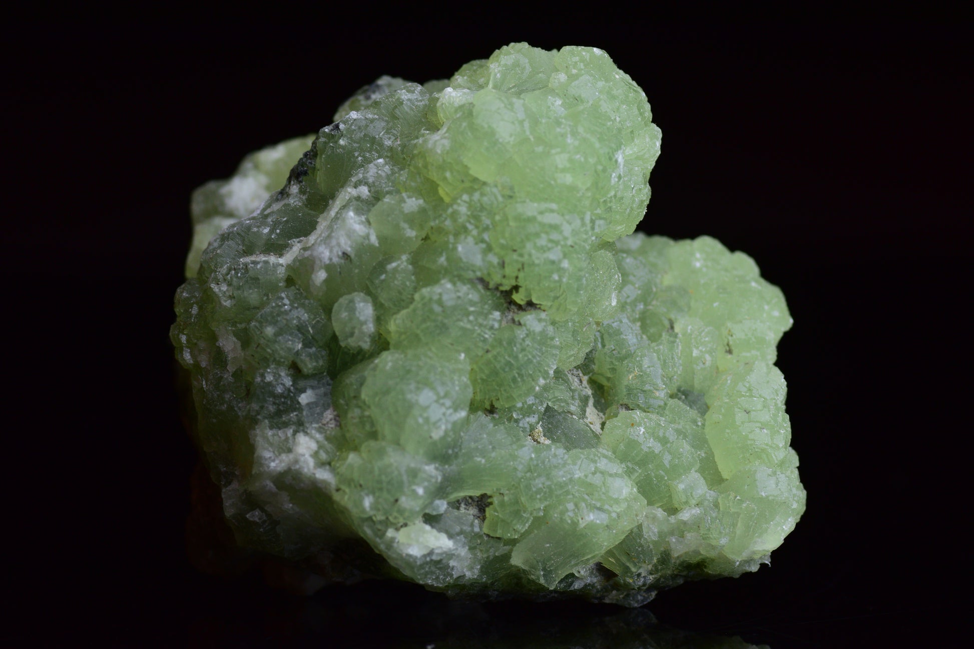 Prehnite and actinolite crystal from Boulemane, Morocco, showcasing vibrant green mineral formations.