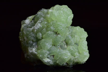 Prehnite and actinolite crystal from Boulemane, Morocco, showcasing vibrant green mineral formations.