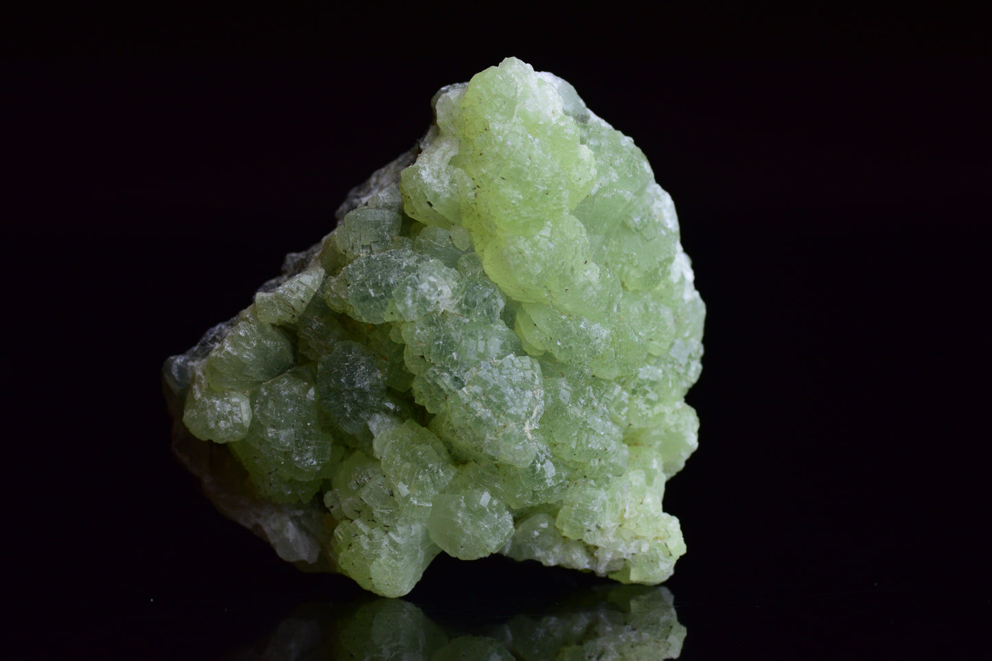 Prehnite and actinolite crystal from Boulemane, Morocco, showcasing vibrant green mineral formations.