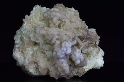 Prehnite crystal from Imilchil, Morocco, showing smooth green mineral with natural mineral formations and a polished surface.