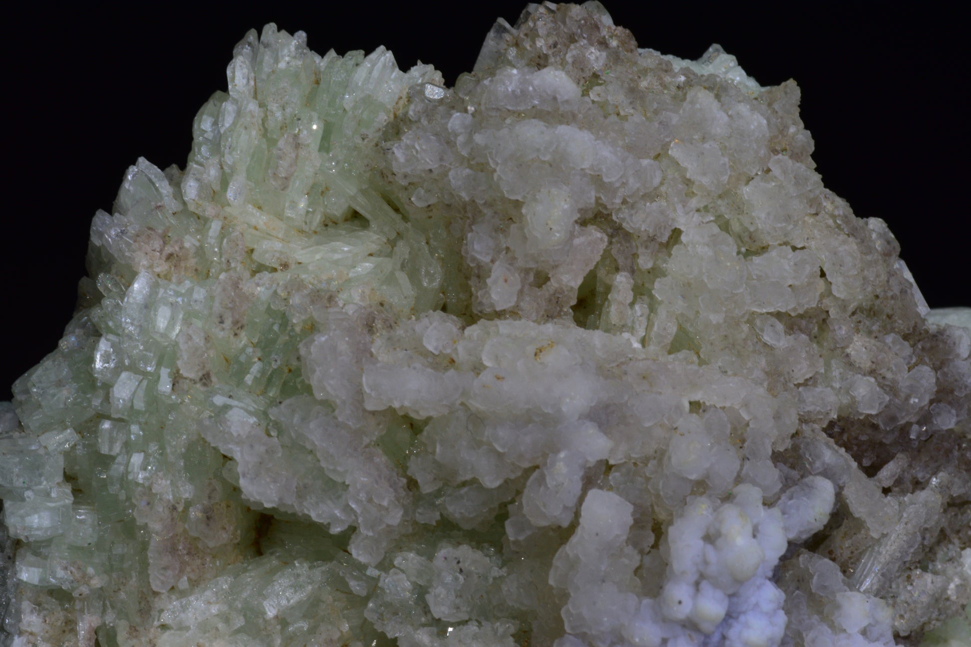 Prehnite crystal from Imilchil, Morocco, showcasing smooth, translucent green mineral with natural formations.