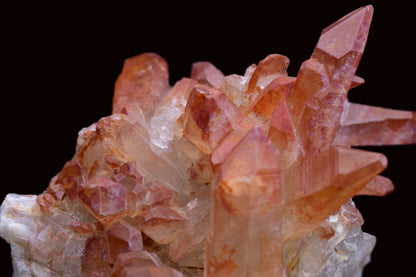 Large red quartz crystal cluster with ferruginous deposits from Tinejdad, Morocco, showcasing vibrant mineral-rich quartz formation.