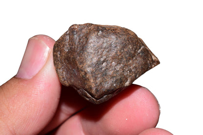 Unclassified meteorite 34.2g — bottom view showing texture