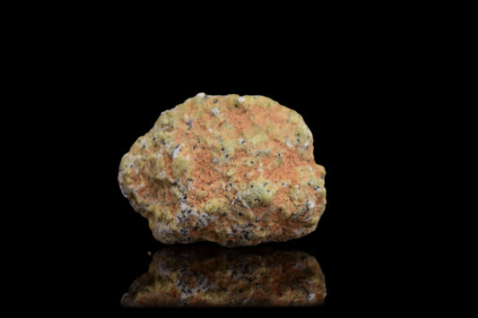 Martian meteorite NWA 12241 from Mars, 0.68g Shergottite, displayed on a neutral background, showcasing its rugged mineral surface.