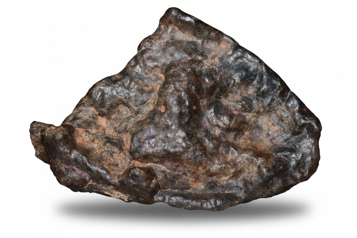 Complete natural fragment of NWA 13272 ungrouped achondrite meteorite, showing its rocky, textured surface, weighs 17.7 grams.