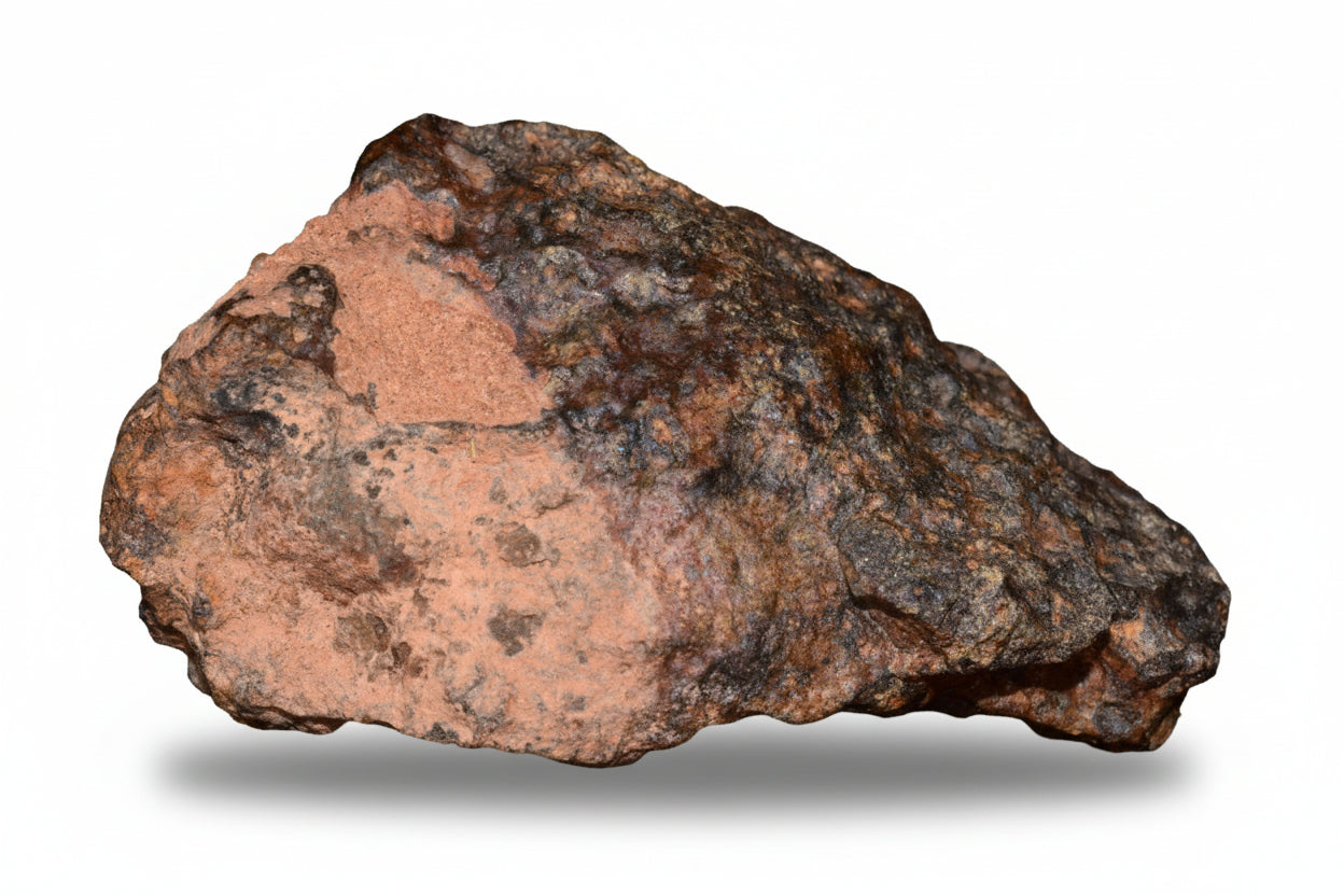 Natural NWA 13272 ungrouped achondrite meteorite fragment, 11.6 g, showing rough, textured surface with unique mineral patterns.