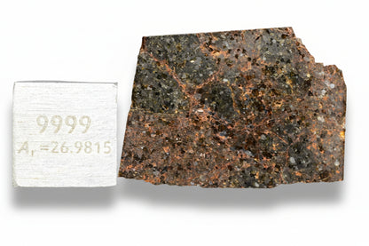 Brachinite NWA 11756 meteorite slice showing dark matrix and mineral inclusions, weighing 3.13 grams.