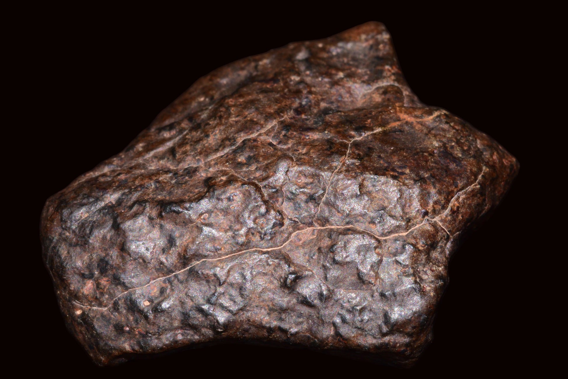 Natural fragment of NWA 13272 ungrouped meteorite, 10.5g, showcasing its unique surface and mineral texture.