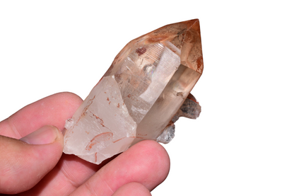 Close-up detail of iron-oxide inclusions and crystal terminations on red Quartz cluster from Tinejdad, Morocco